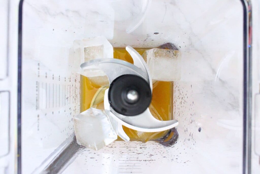 add whiskey, peach nectar, lemon juice, and ice to blender