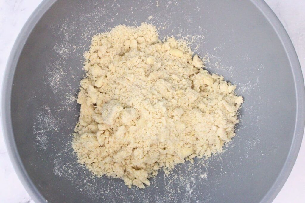 combine flour, brown sugar, and butter in a bowl and mix until clumps form