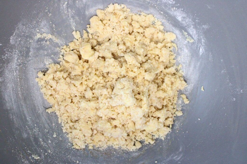combine flour, brown sugar, and butter to make peach crumble topping mixture