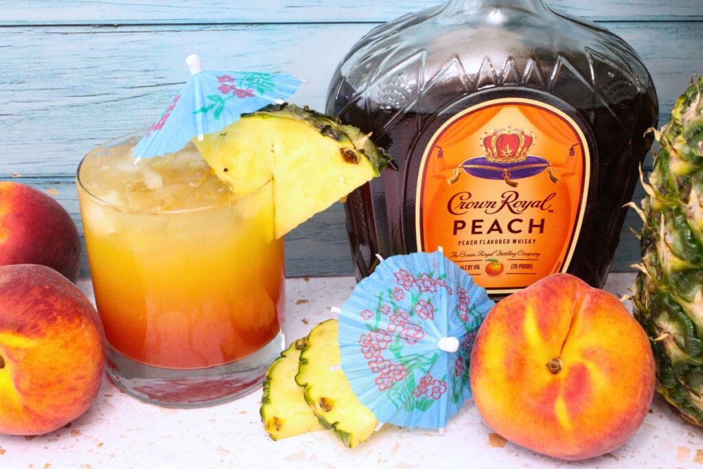 crown peach beach drink next to crown royal peach bottle