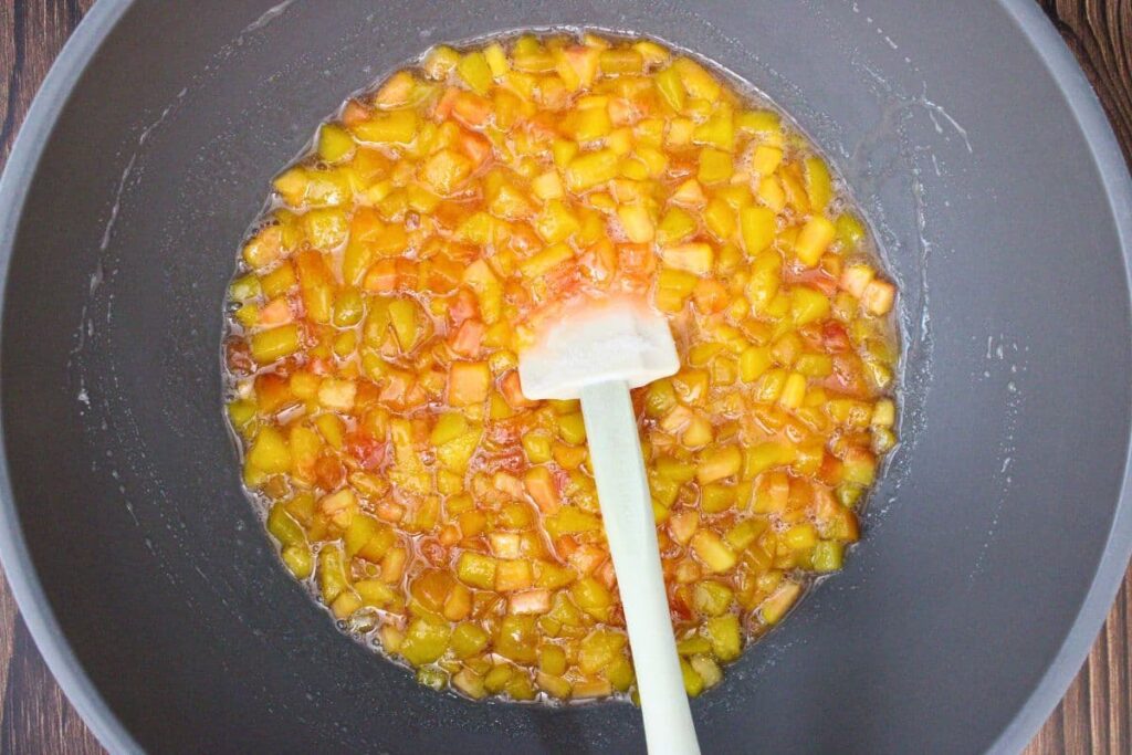 fully dissolve sugar into cooked peaches