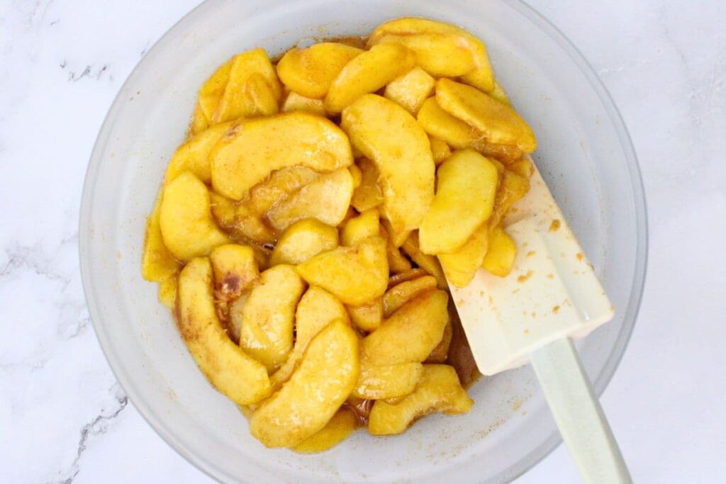 mix the peaches, cornstarch, lemon juice, vanilla, brown sugar, and cinnamon in a microwave safe bowl