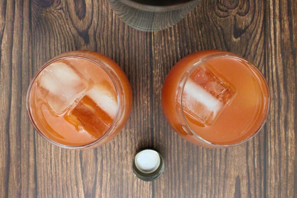 shake and strain peach fuzz into ice filled glasses