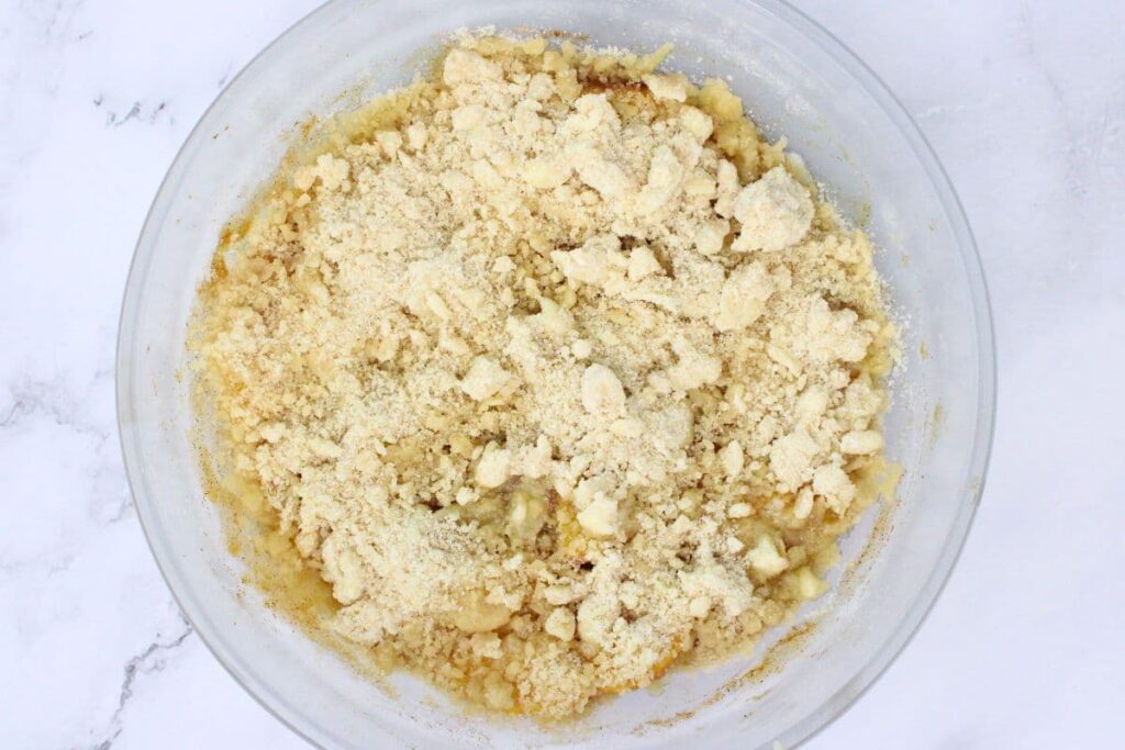 sprinkle crumble mixture over microwaved peaches