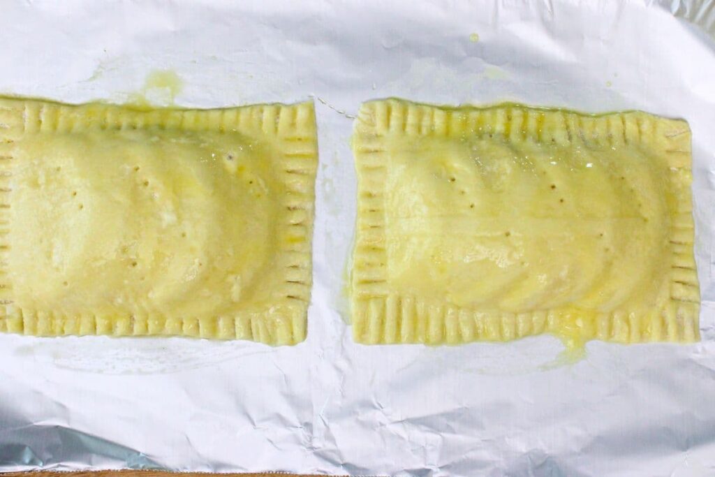 brush egg wash on top of peach puff pastry