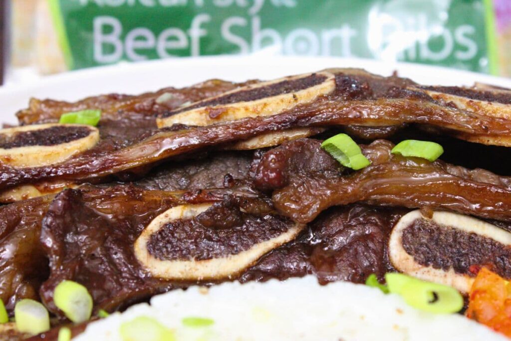 closeup view of air fryer trader joes korean short ribs over rice