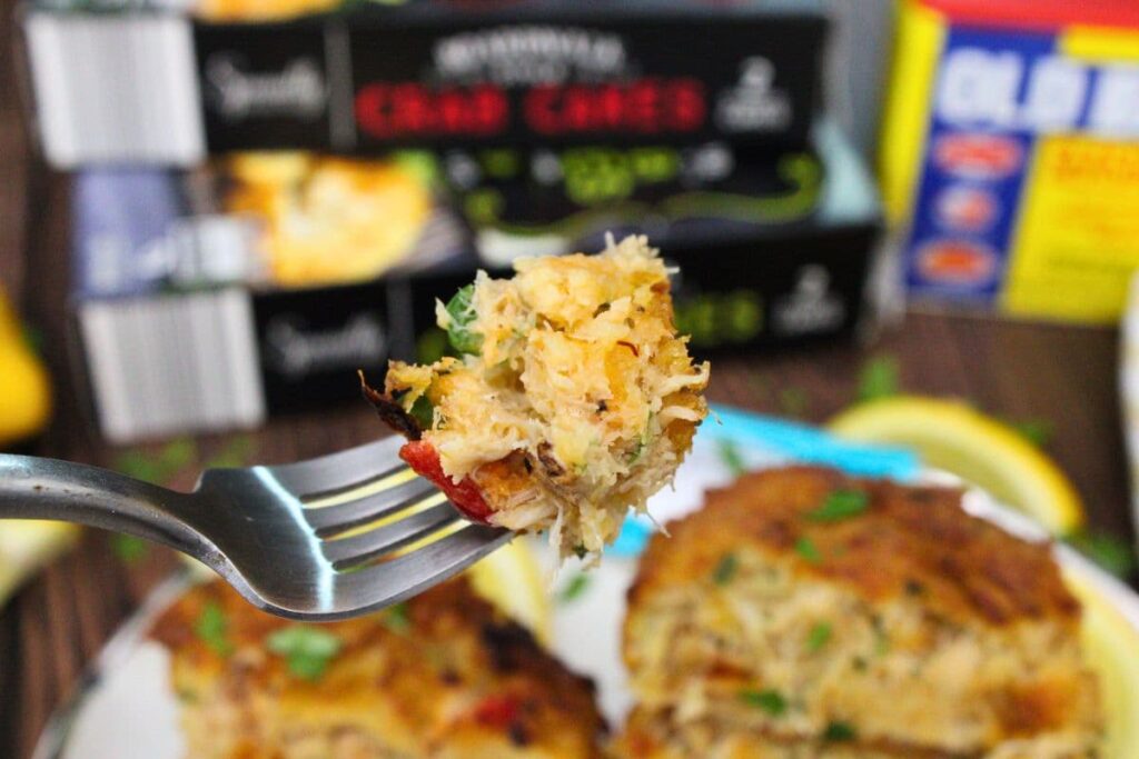 holding up a forkful of aldi crab cakes