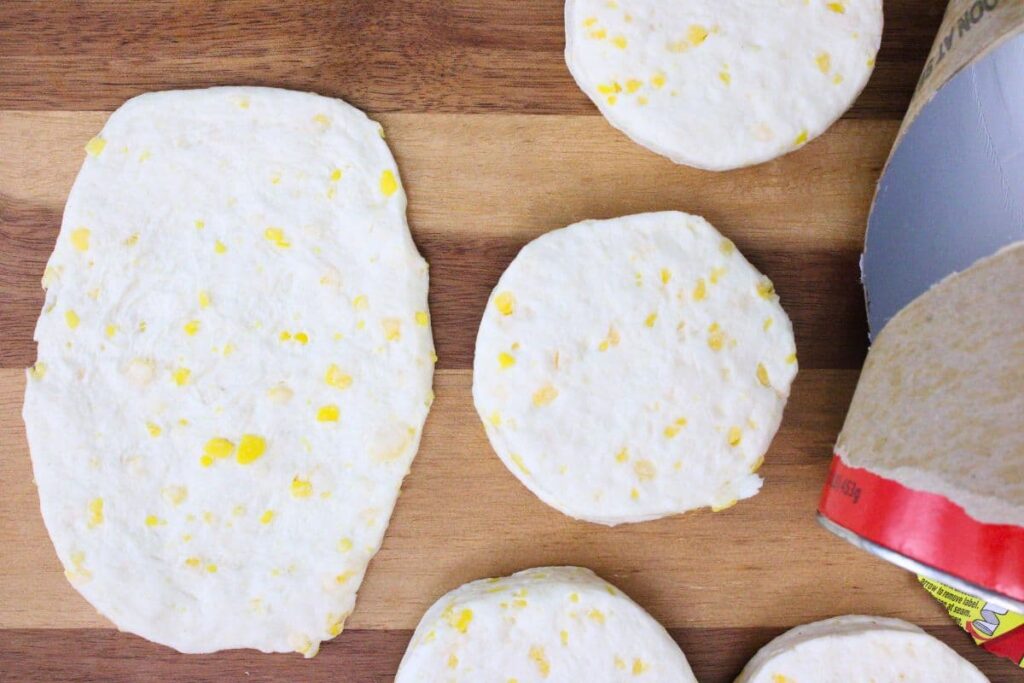 open your can of biscuits separate and flatten them
