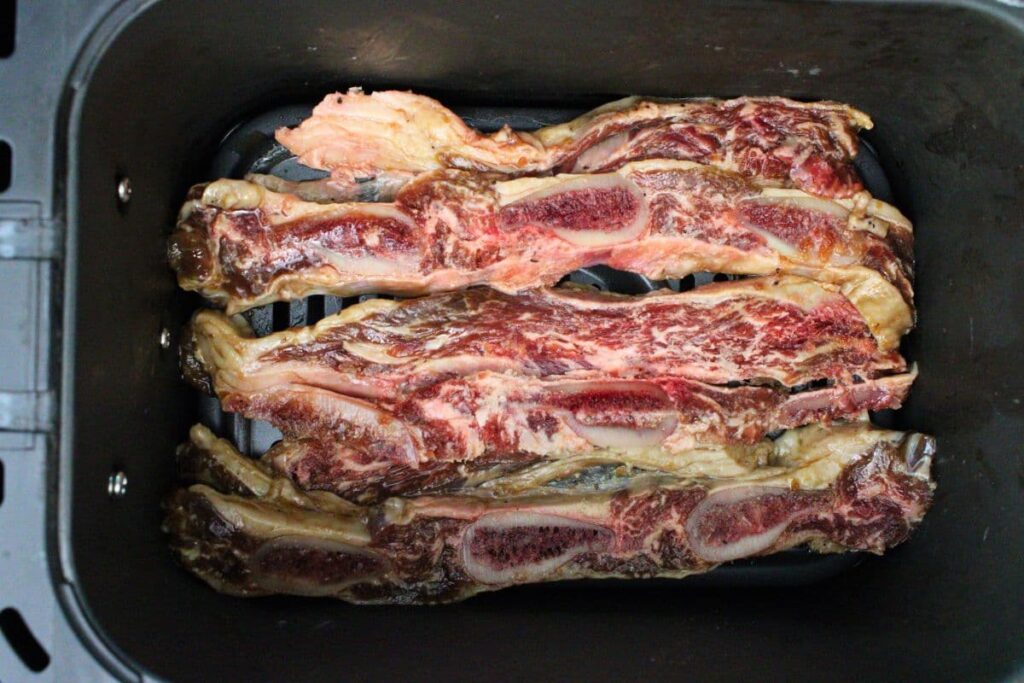 place trader joes korean short ribs in air fryer basket