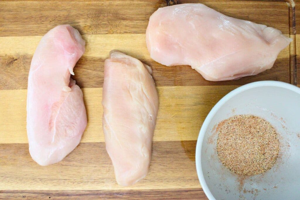 trim chicken and blend spices in a small bowl