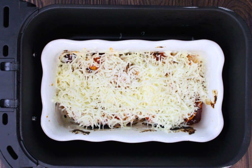 added shredded mozzarella on top of the stuffed shells