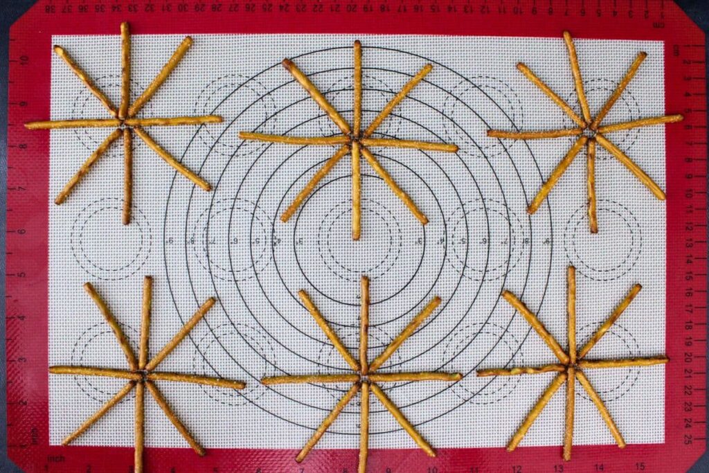 arrange pretzels in a spoke pattern on baking mat