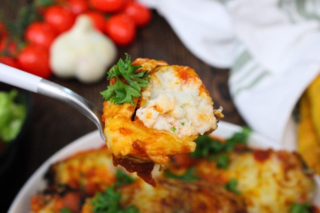 holding up a fork with a piece of air fryer aldi stuffed shell