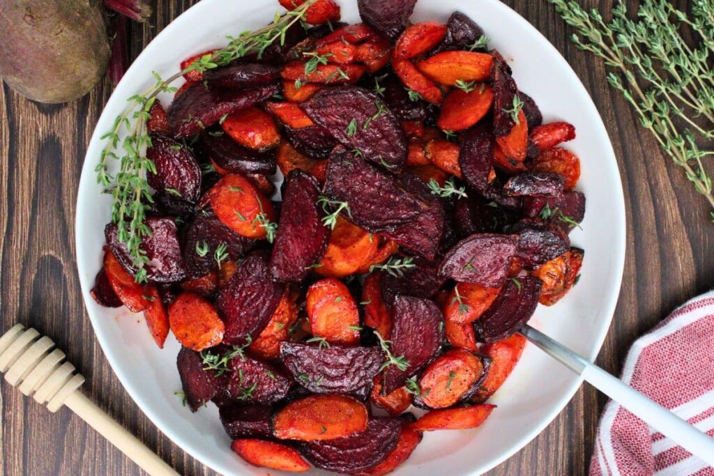 overhead view of air fryer beets and carrots in a bowl