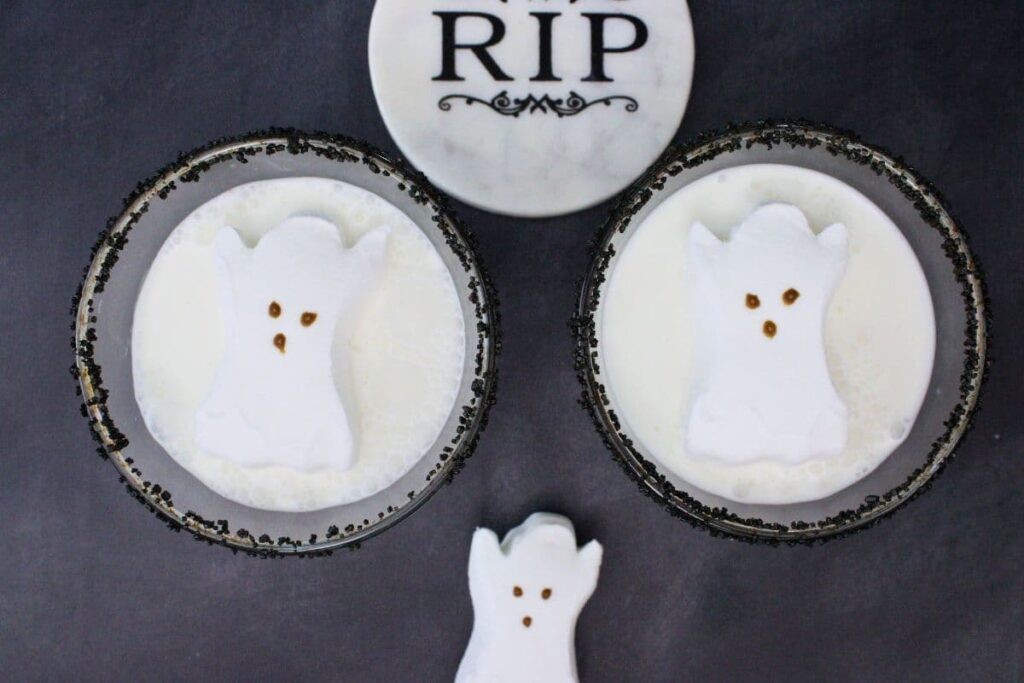 overhead view of two ghost martinis with ghost peeps on top