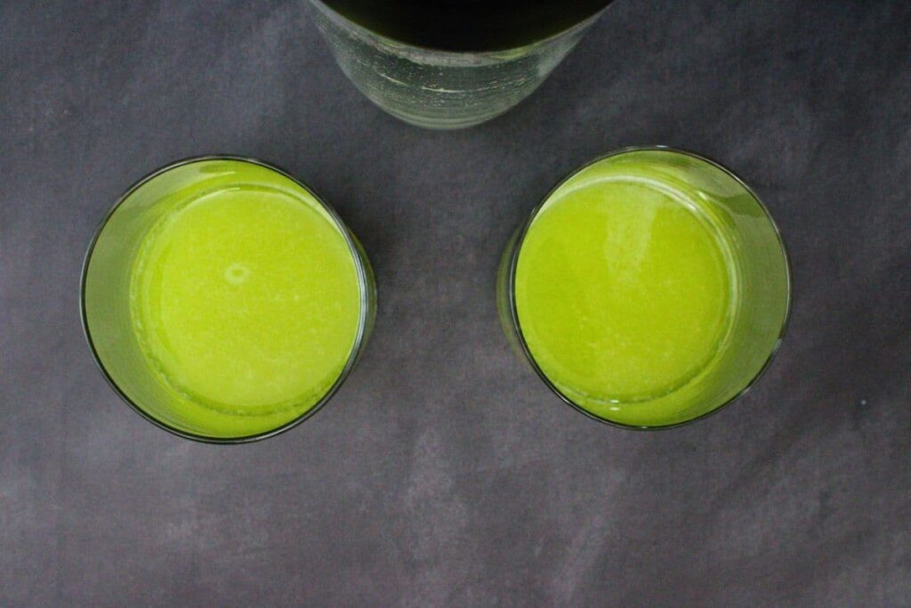 shake and strain ghostbusters cocktail into lowball glass