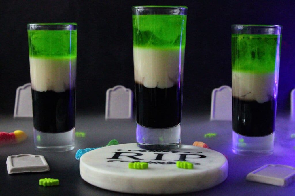 three layered beetlejuice shots with a RIP coaster and light background fog