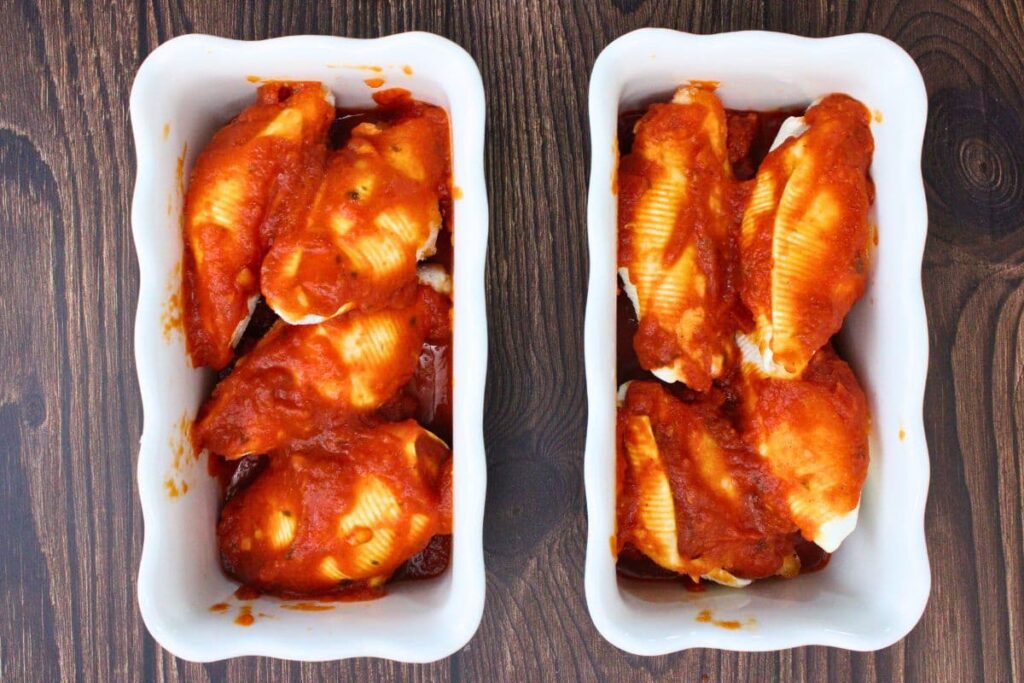 top stuffed shells with remaining pasta sauce