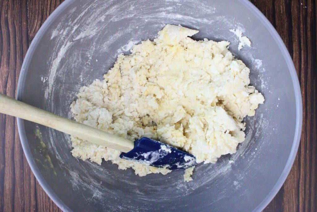 add eggs, milk, and orange juice to make a shaggy dough