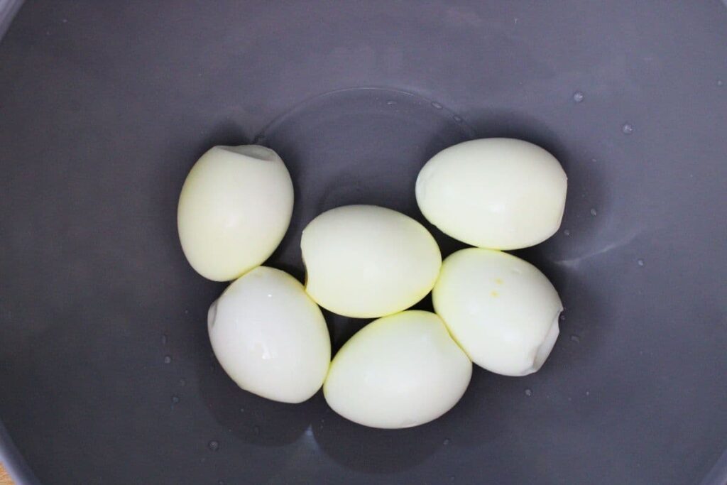 carefully peel hard boiled eggs