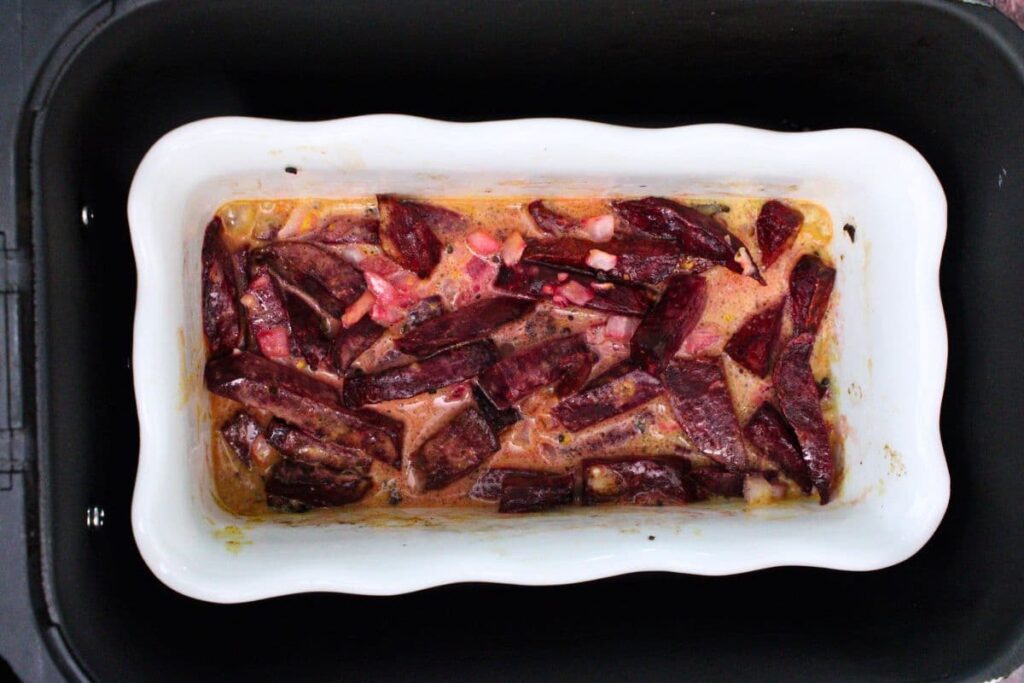 combine coconut milk and remaining seasoning then pour evenly over the vegetables