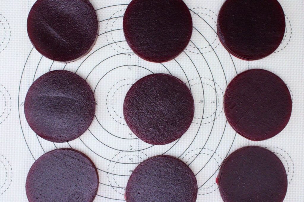 place cranberry sauce rounds on a silicone baking mat