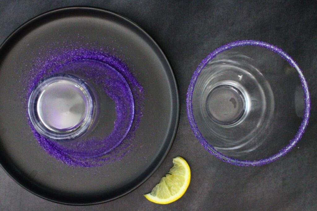 rim wicked witch cocktail glass with purple sanding sugar
