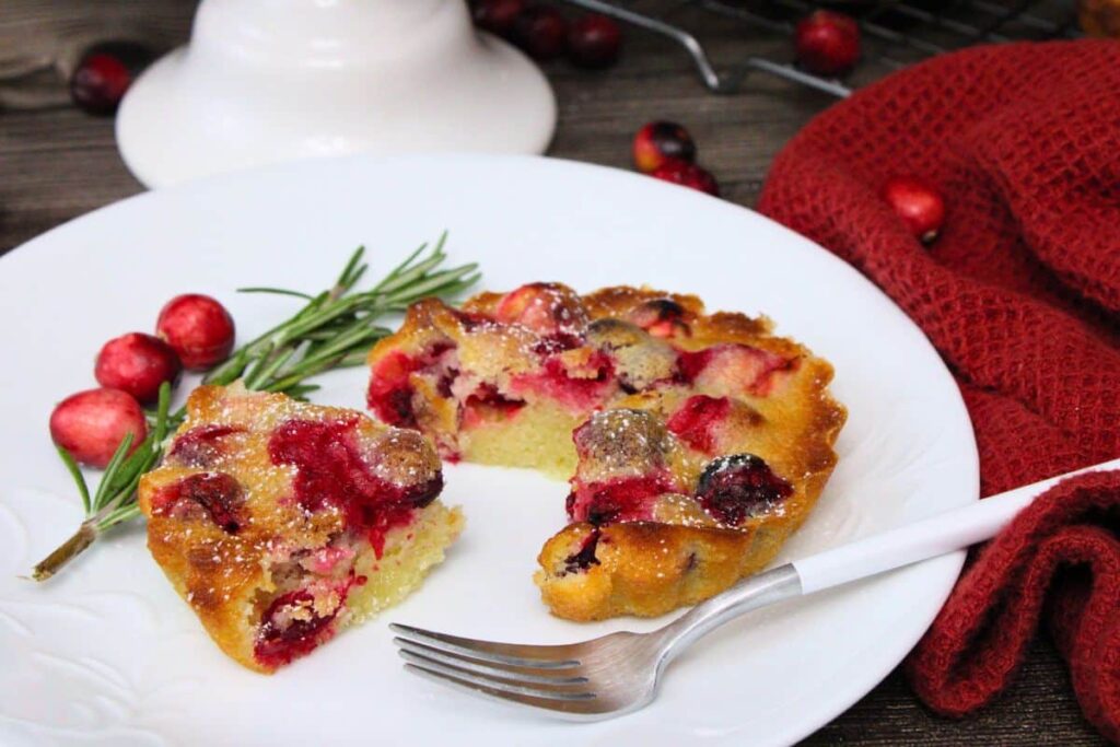 cutting a small slice out of an air fryer mini crustless cranberry pie