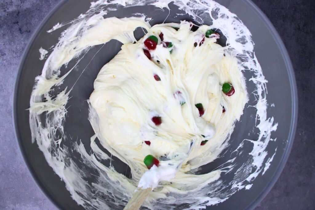 fold dots into marshmallow mixture