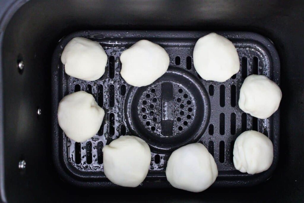 place cranberry brie bites in air fryer basket
