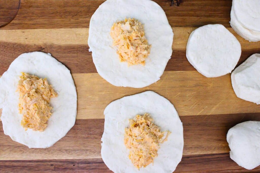 add two mounded tablespoons of chicken mixture to each biscuit
