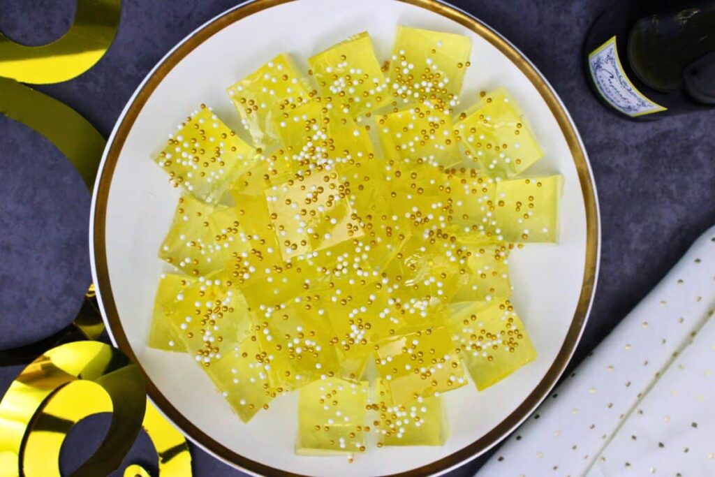 overhead view of champagne jello shot squares on a plate
