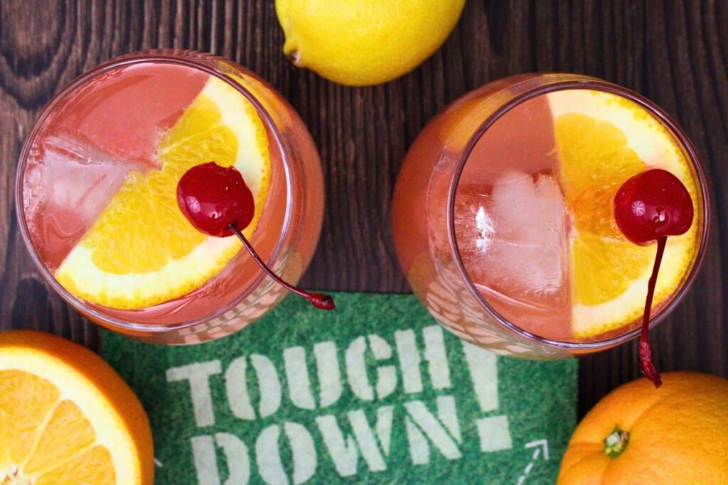 overhead view of two touchdown punch drinks garnished with fruit