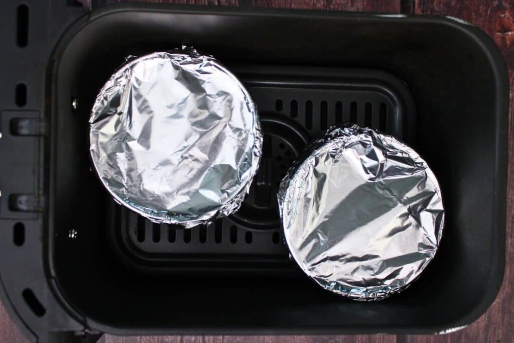 place foil covered ramekins in air fryer basket
