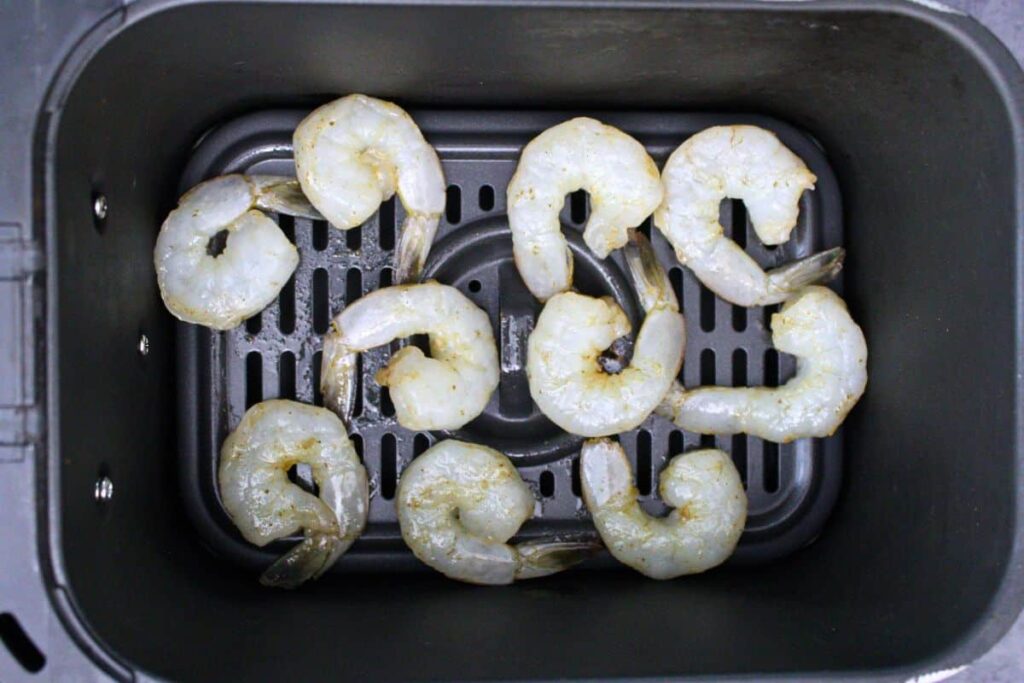 place seasoned shrimp in air fryer basket