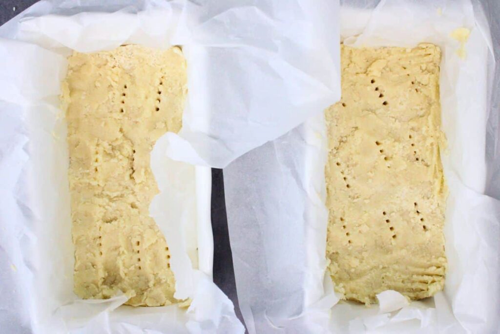 press shortbread dough mixture into baking dishes and poke with fork
