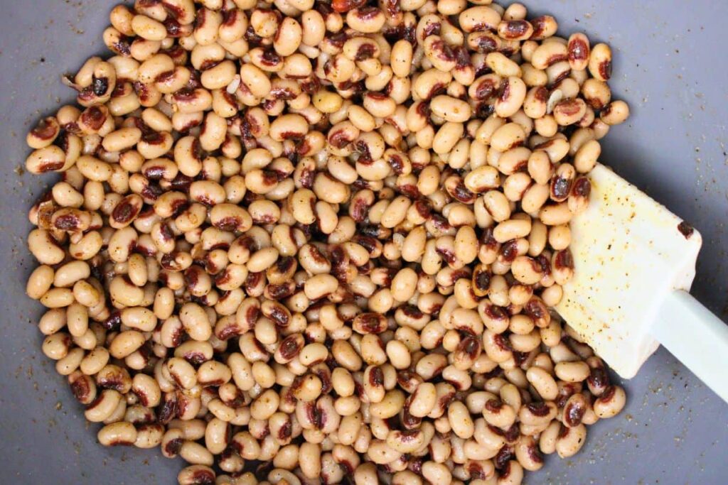 toss black eyed peas in olive oil and cajun seasoning