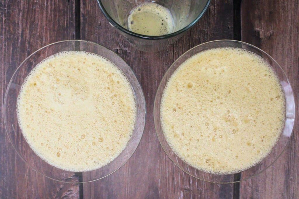 shake and strain frothy chai espresso martini into glasses