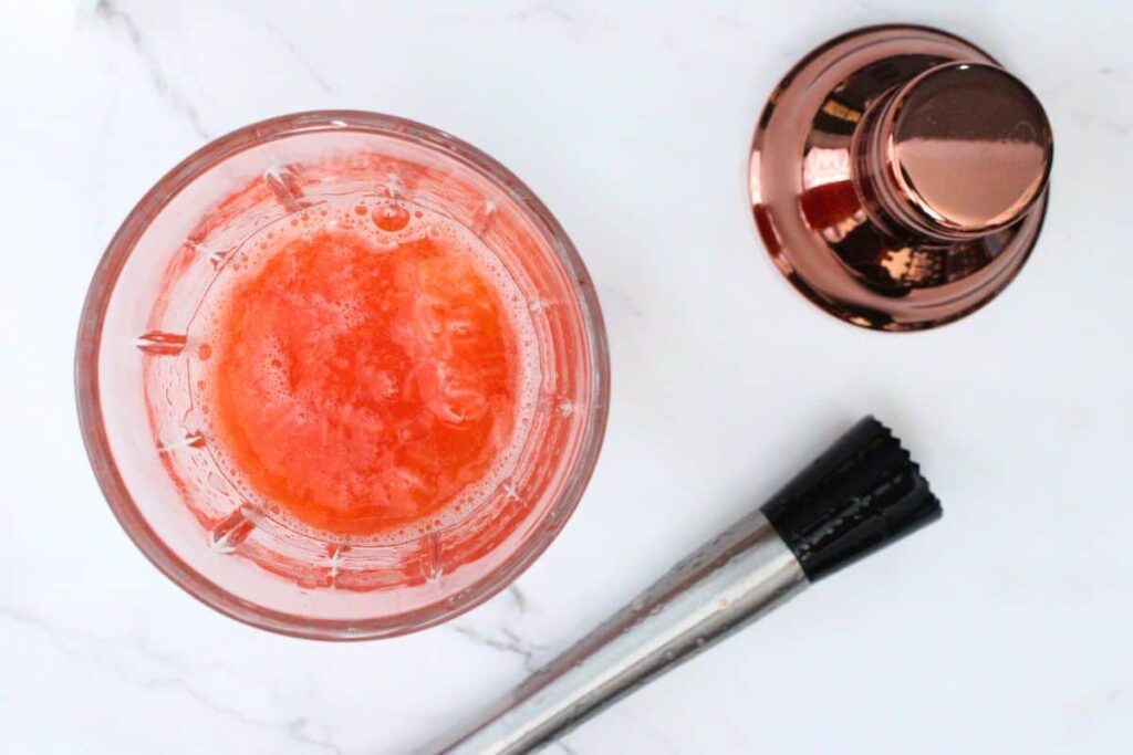 muddle fresh strawberries with lemon juice and simple syrup in a cocktail shaker