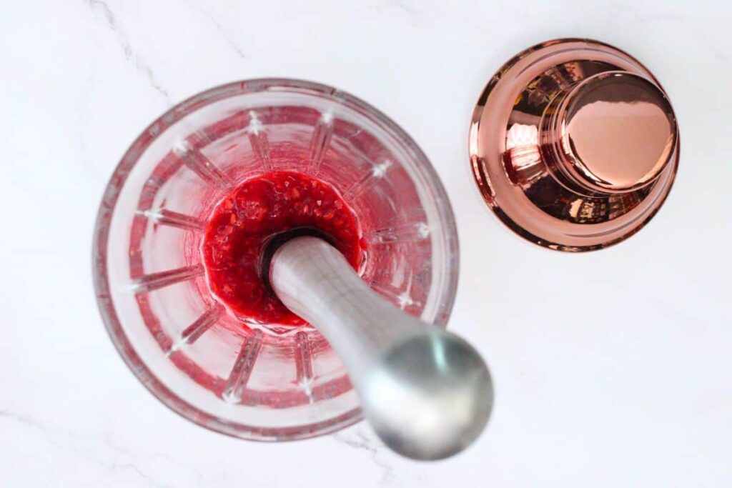 muddle raspberries in the bottom of your shaker