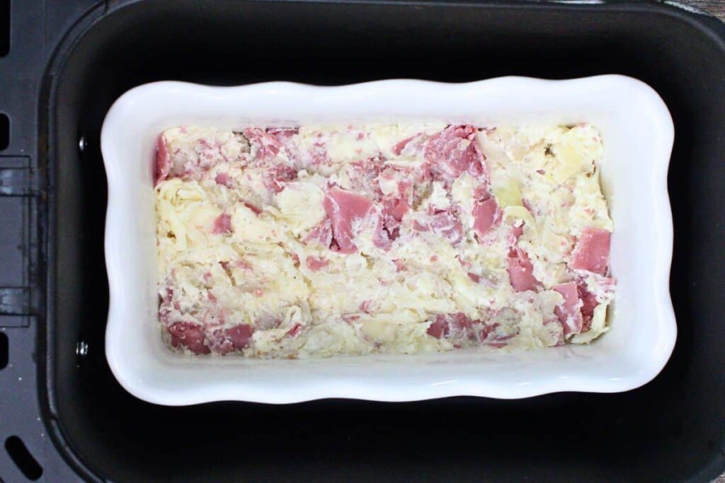 place baking dish with reuben dip in air fryer basket