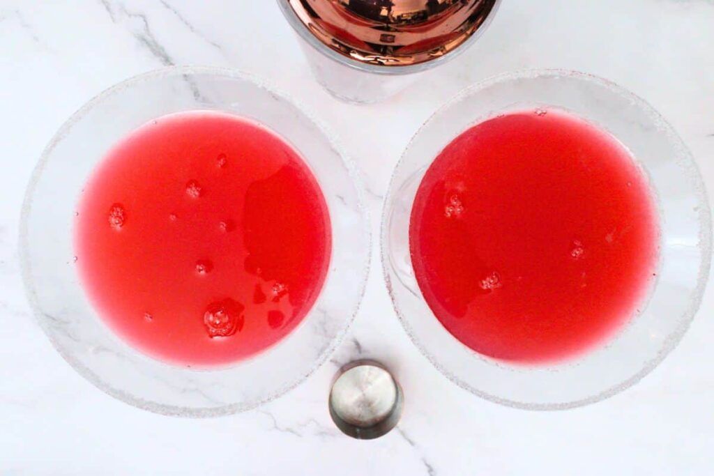 shake and strain raspberry lemon drop into prepared glasses