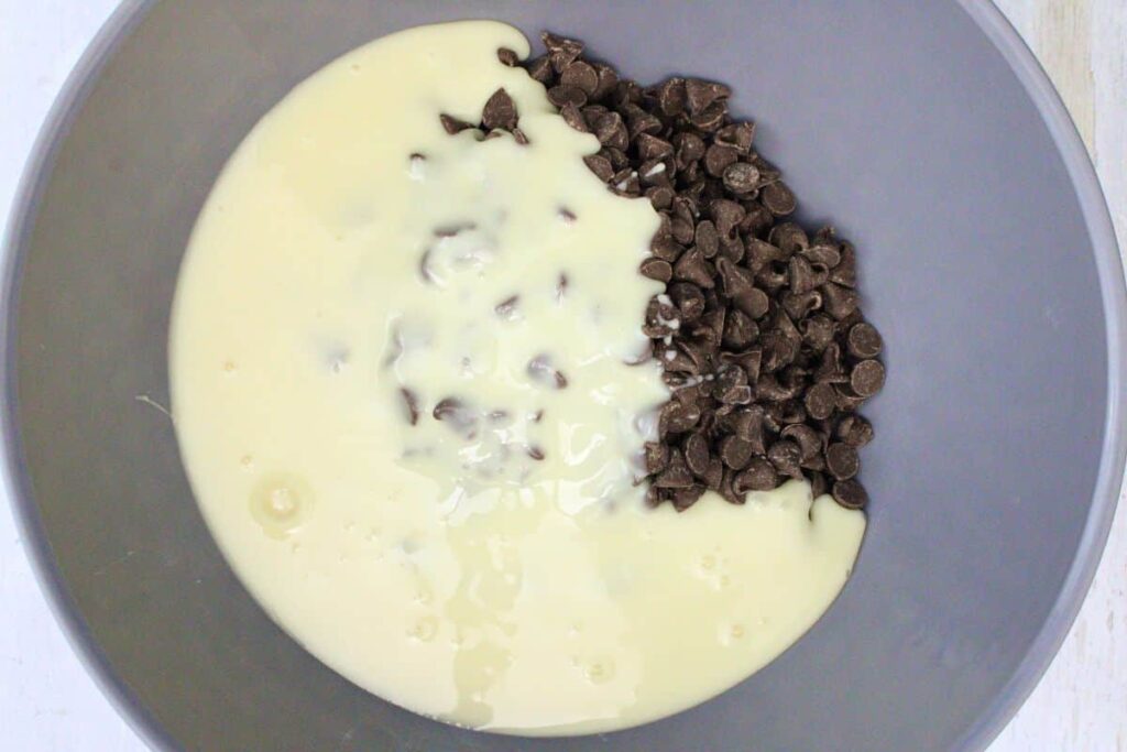 add chocolate chips and sweetened condensed milk to large microwave safe bowl