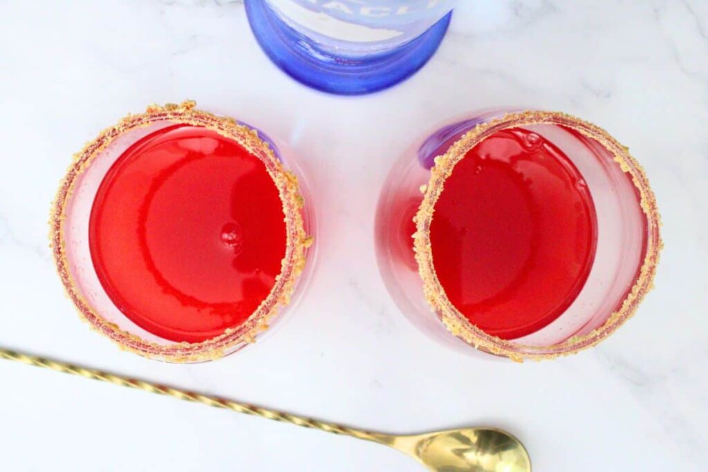 add whipped cream vodka and strawberry puree to glass