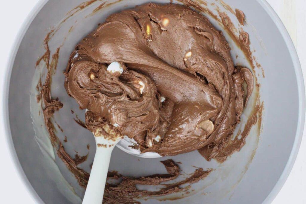 fold in mini eggs to chocolate mixture