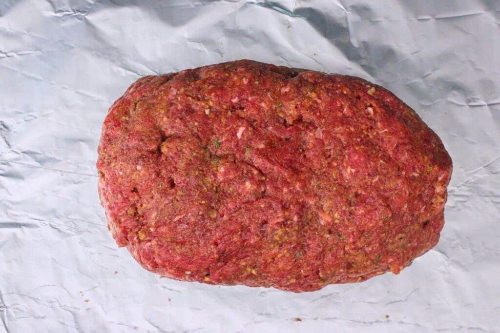 add cheese to center and form meat into loaf shape