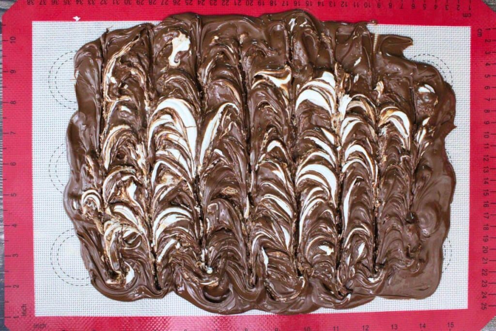 add marshmallow fluff and white chocolate mixture over chocolate