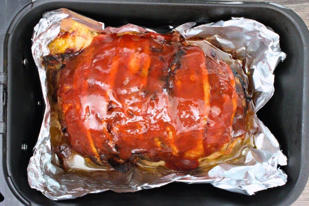brush ketchup glaze over top of meatloaf
