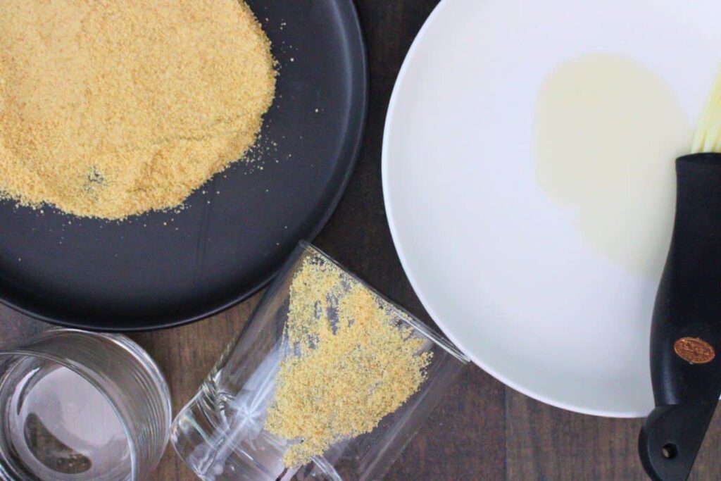 dip the side of your glass in marshmallow syrup and then graham crumbs