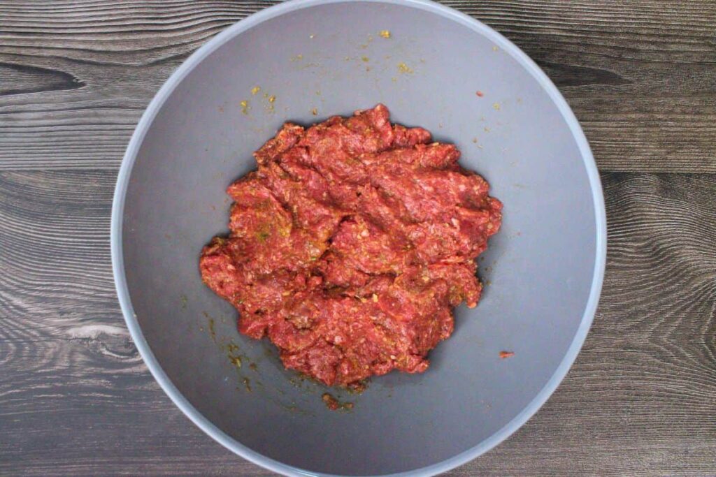 in a large bowl combine ingredients for meatloaf